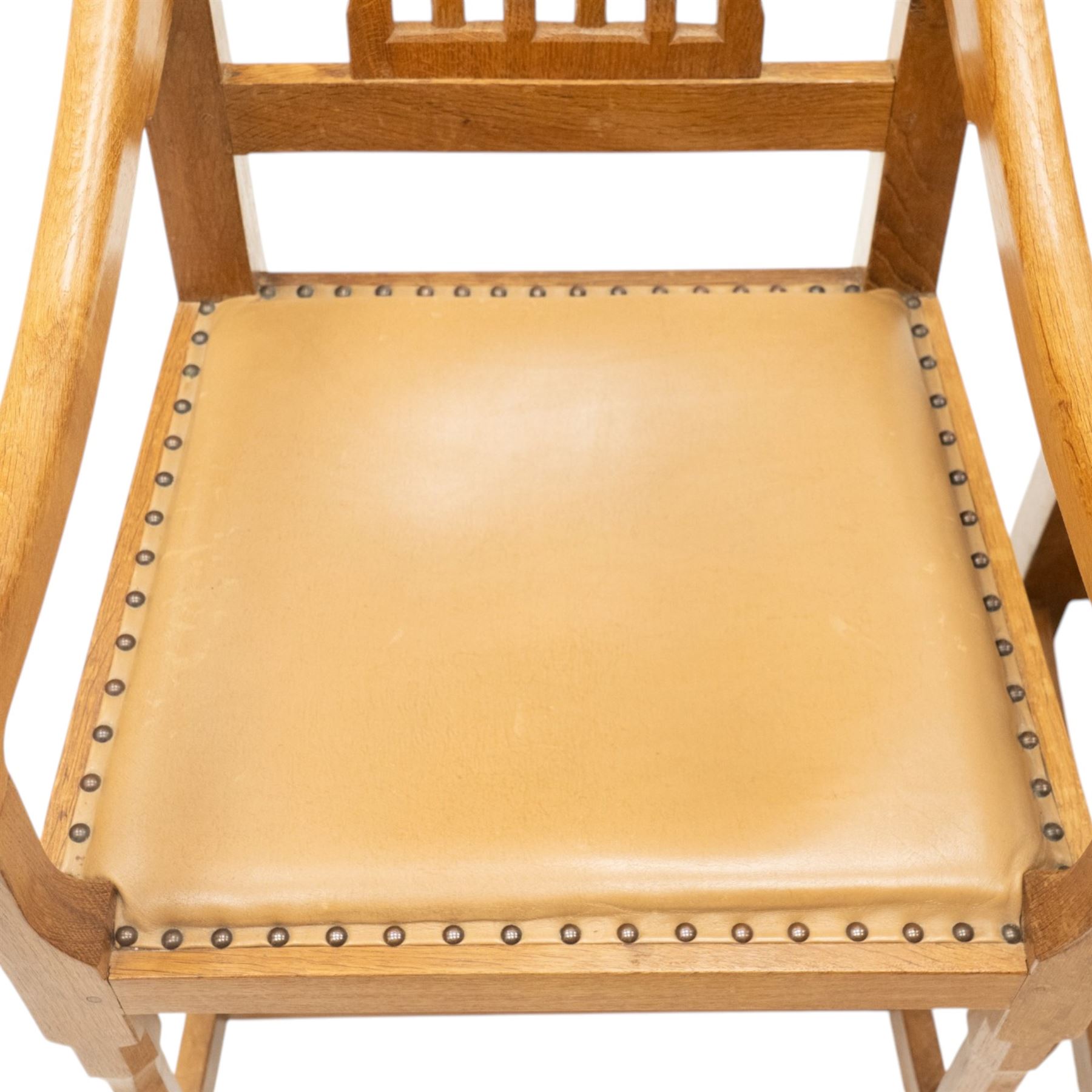 Rabbitman - pair of Yorkshire oak carver open armchairs, pierced and carved lattice back over tan leather seat with studwork, raised on octagonal supports united by H stretchers, carved with rabbit signature, by Peter Heap of Wetwang