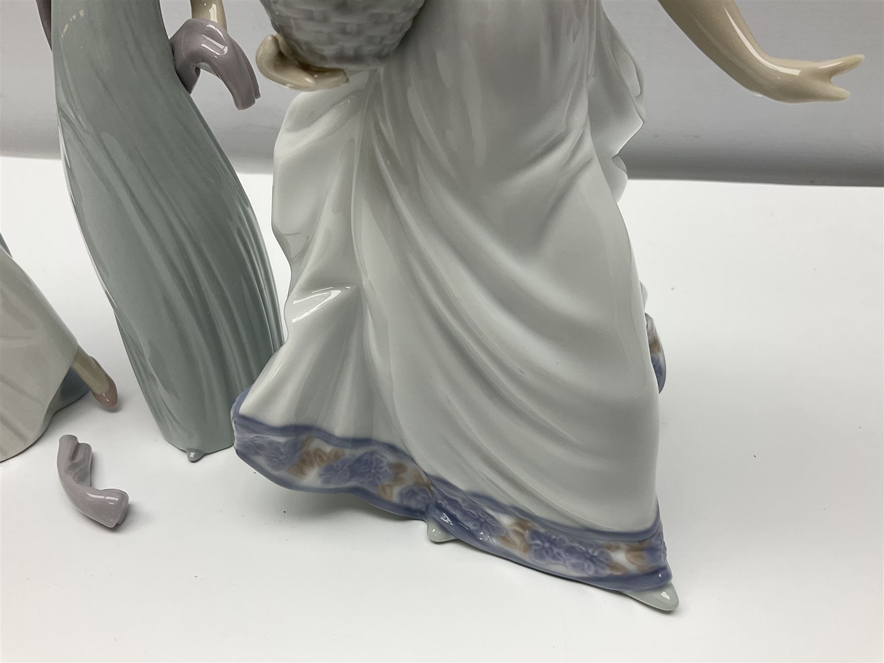 Three Lladro figures of ladies comprising 'The Flirt' model no 5789, 'Ingenue' model no 5487 and 'Carefree' model no 5790, all with boxes