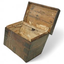 19th century metal bound ship’s trunk, of trapezoidal form with hinged lid, iron strapwork and corner reinforcements, remains of paper lining to interior