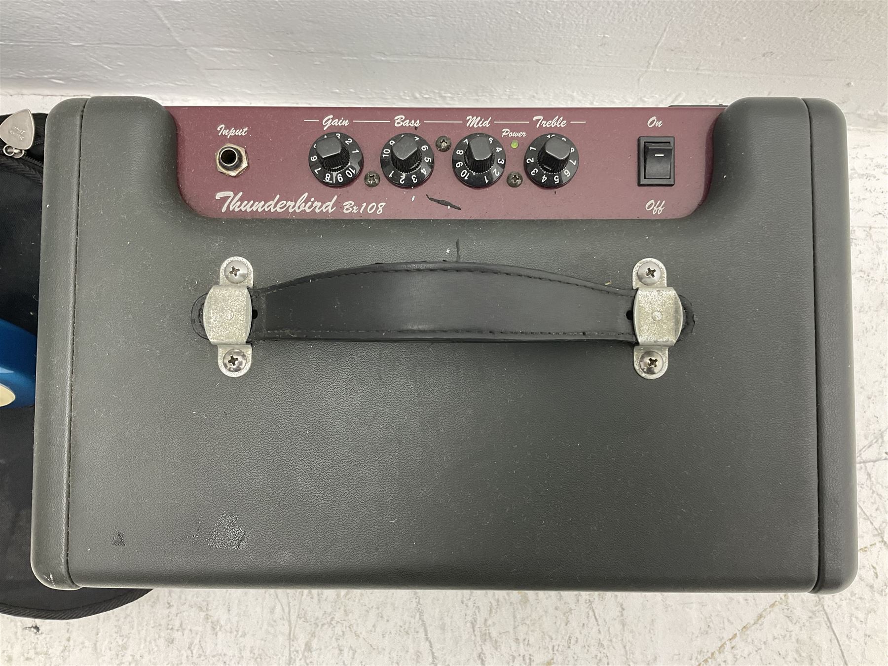 Richwood electric bass guitar in blue, cream and natural finish L117cm; in Fender soft carrying case; together with Behringer Thunderbird Bx108 amplifier date code 0 4 11.