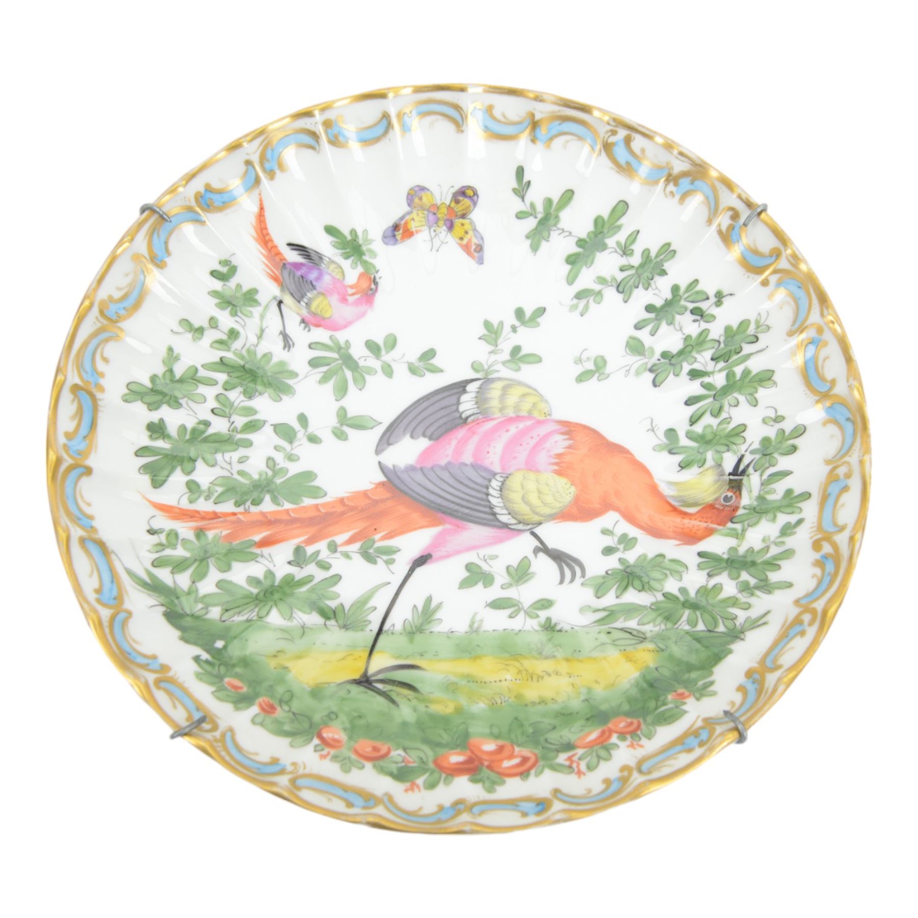 Two 19th century Samson porcelain plates, decorated in the Chelsea style with exotic birds, flowers and insects, each with spurious gold anchor mark verso, largest example D24cm, together with a 19th century dessert plate, possibly Worcester, hand painted with a hummingbird, within a gilt band and pink border, D22.5cm, and a further 19th century dessert plate with shaped and pierced rim, hand painted with a view of Loch Lomond and titled verso, D22cm, (4)
