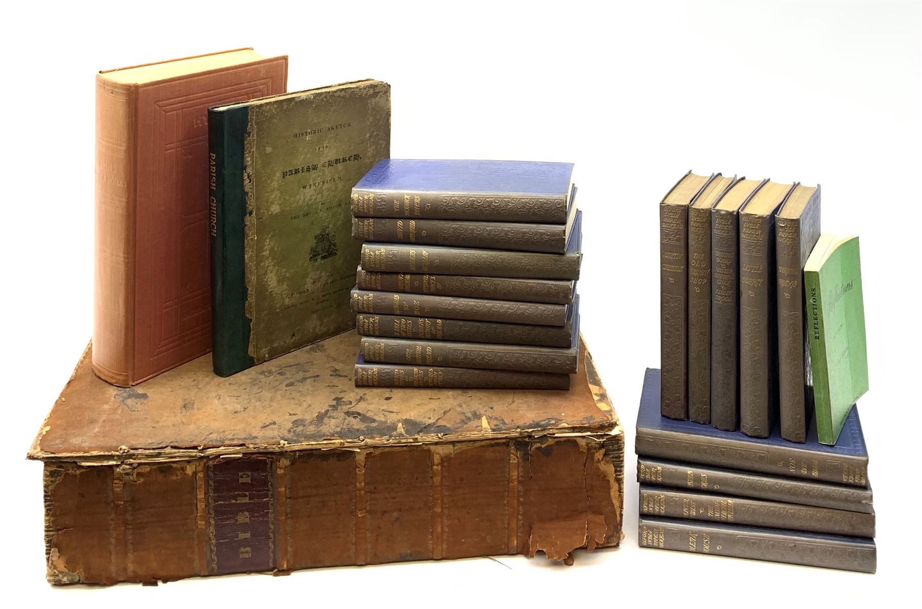 The Holy Bible containing the Old and New Testaments. 1816. Engraved title page and plates. Large folio. Full suede leather binding; Complete Works of Charles Dickens. Oxford India Paper Edition. Seventeen uniformly bound volumes illustrated by Cruikshank, Phiz etc; Sisson Rev. J.L.: Historic Sketch of the Parish Church, Wakefield. 1824; and other books