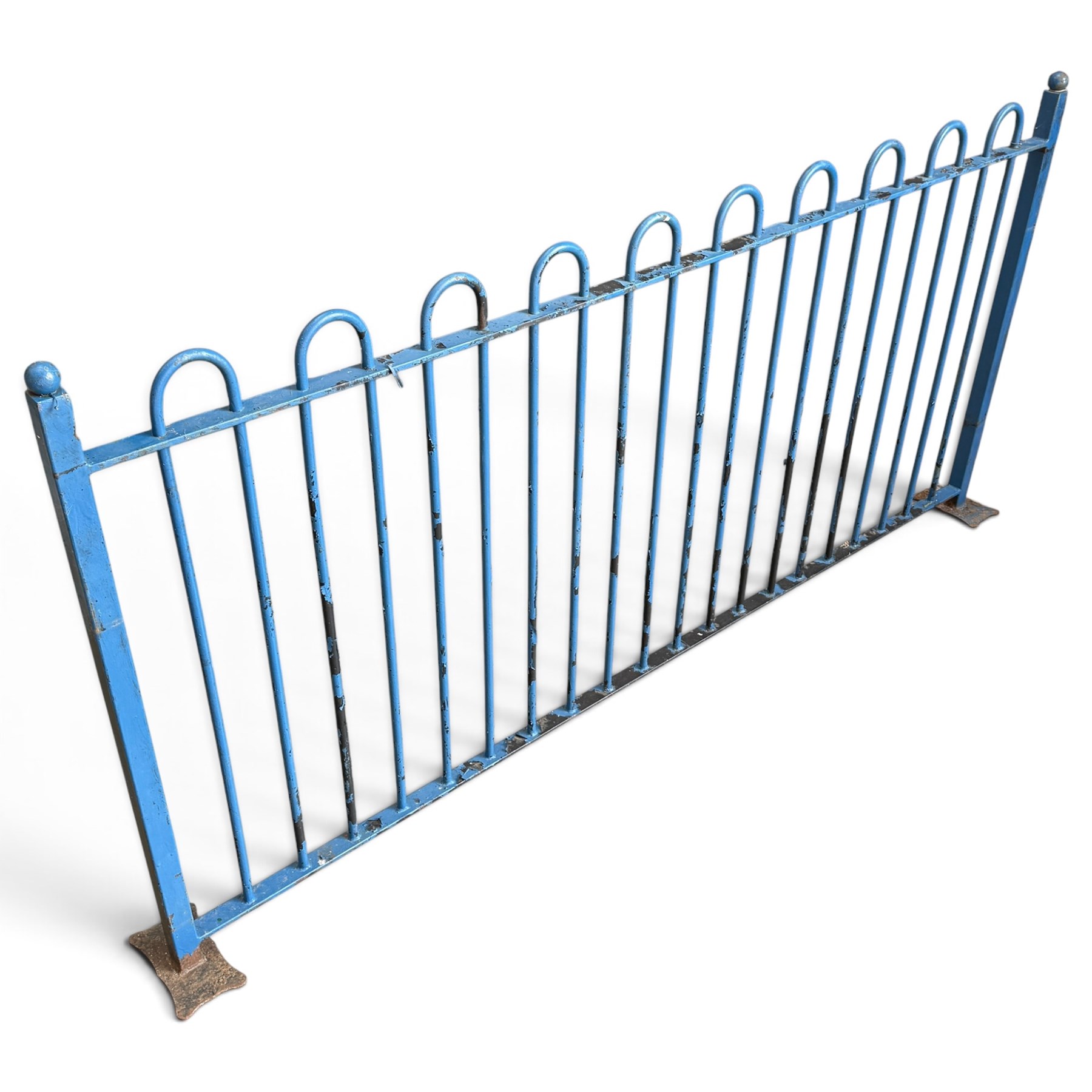 Two sections of painted iron garden or estate boundary railing, comprising a 19th century wrought iron section with graduated spearhead uprights, together with a later hoop-top section with ball-finial end posts, both in blue painted finish