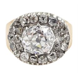George III gold and silver old cut diamond cluster ring, the principal diamond of approx 0.75 carat, with pave set old cut diamond surround
