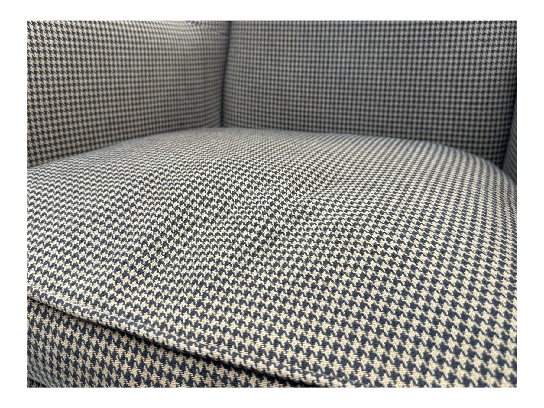 Hardwood-framed wingback armchair, upholstered in dog tooth pattern fabric, on cabriole supports 