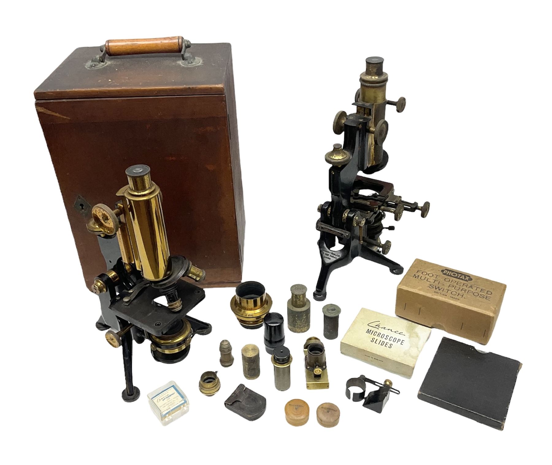 19th century brass and black japanned monocular microscope by W. Watson & Sons Ltd. 313 High Holborn, London serial no.24788 with rack and pinion focussing on tripod base H31cm; in fitted mahogany case retailed by A.H. Baird Scientific Instrument Makers Edinburgh; quantity of additional lenses and accessories; together with another similar uncased monocular microscope by W. Watson serial no.58379 (2)