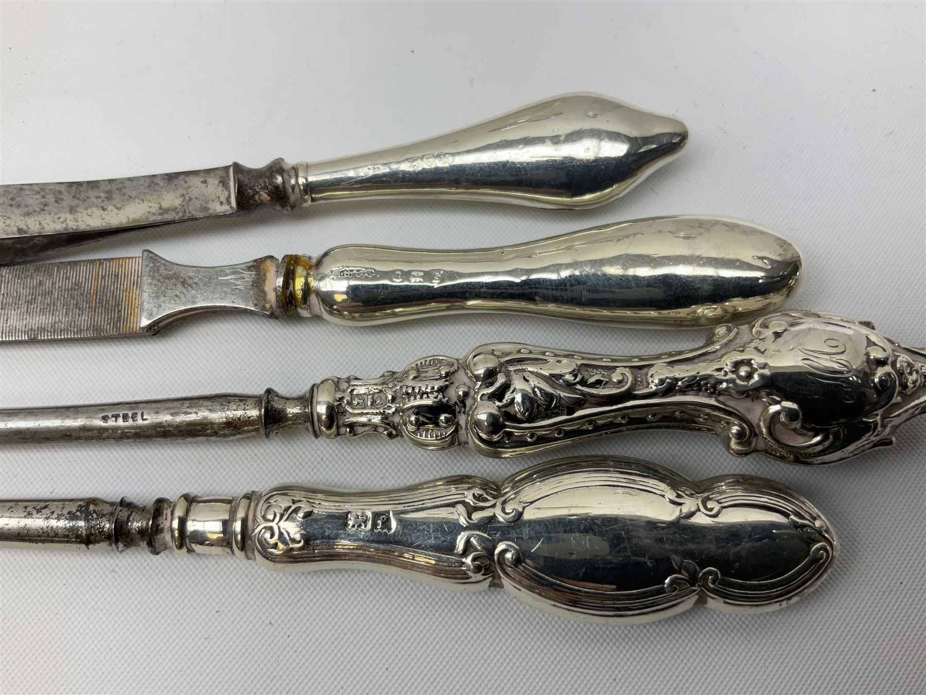 1920's silver stand, hallmarked Birmingham 1922, together with two tall faceted clear glass dressing table jars with hallmarked silver covers, and cut glass vase with hallmarked silver mounted collar, and small group of silver handled accessories, including files, picks, etc., approximate total silver weight 58.8 grams