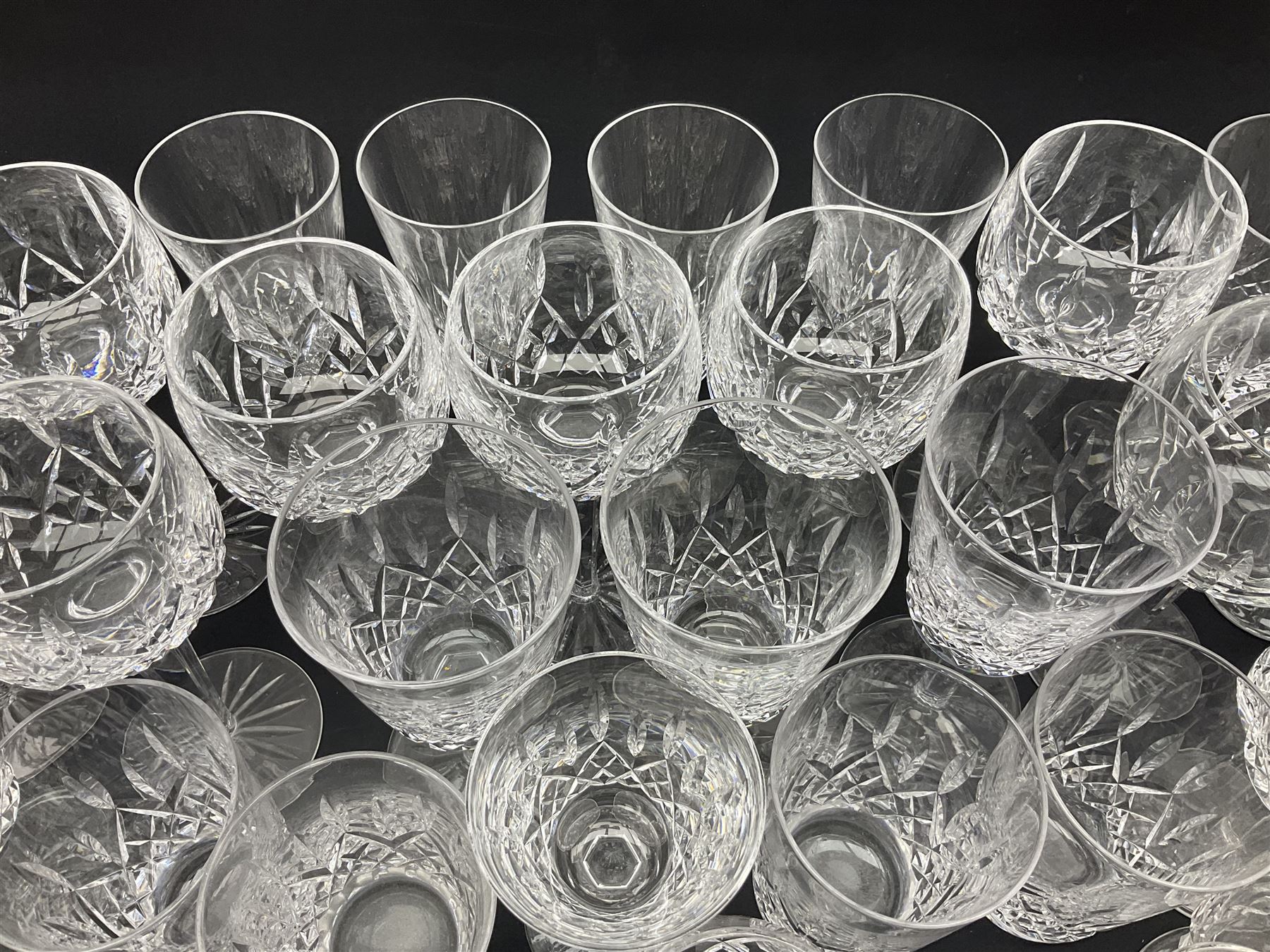 Set of Waterford Crystal Lismore pattern drinking glasses for six people, including hock glasses, goblets, champagne flutes,  sherry glasses, liqueur glasses, hi ball glasses, whisky glasses, brandy balloons, etc, all with etched maker's mark beneath  (62)