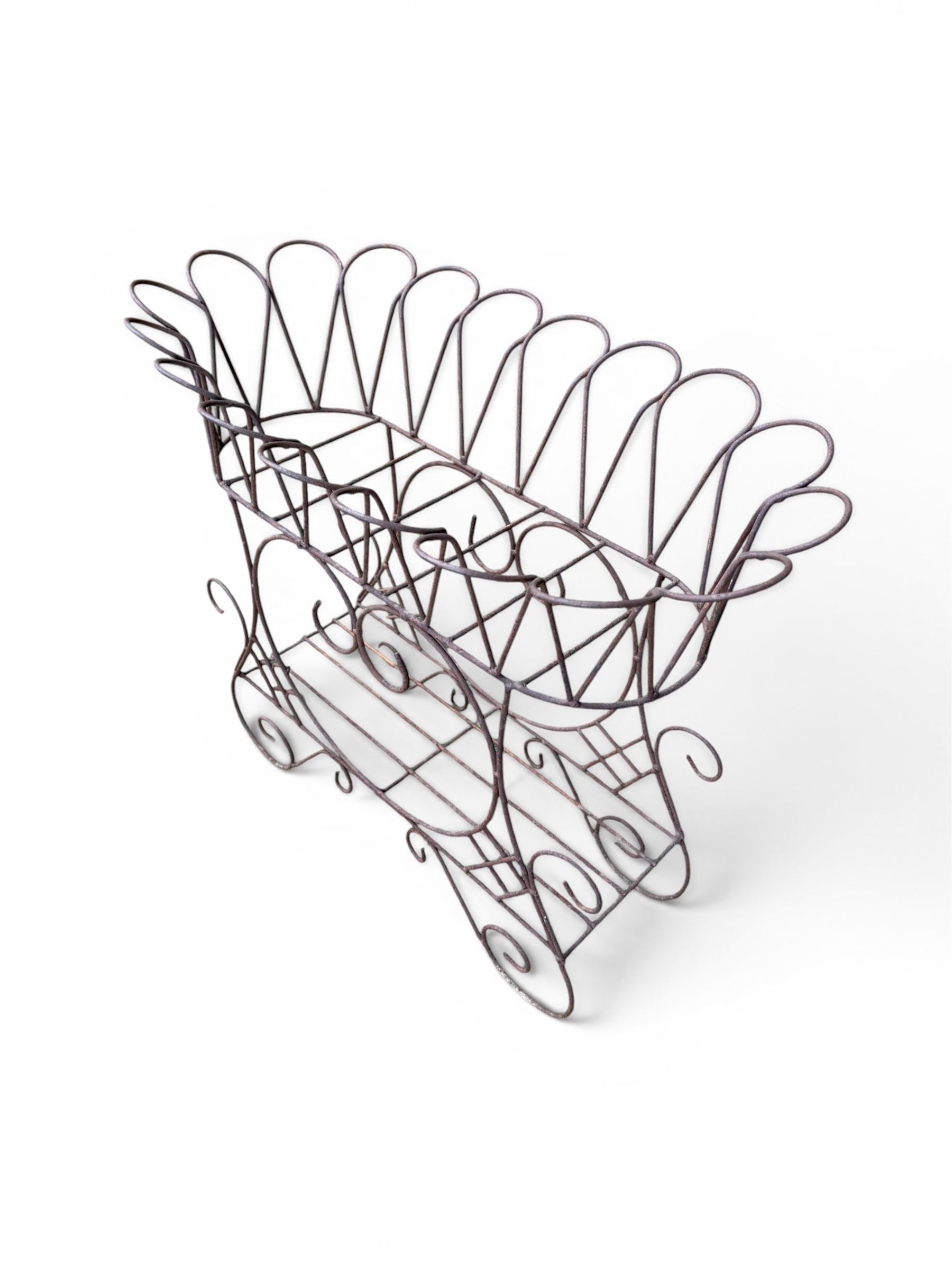 Mid-20th century wirework garden planter, oval form with heart shaped centre, under-tier shelf above scrolling feet