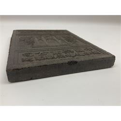 20th century Chinese tea block of rectangular form, moulded with three panels of a Chinese temple above script and below row of stars, the reverse decorated with geometric design on a crosshatched lozenge ground, W18.5cm L23cm