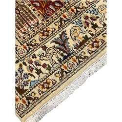 Persian Heriz design rug, ivory ground with rectangular panels each depicting garden scenes of tree of life, plants and Boteh motifs, the guarded border decorated with wildlife and bird scenes