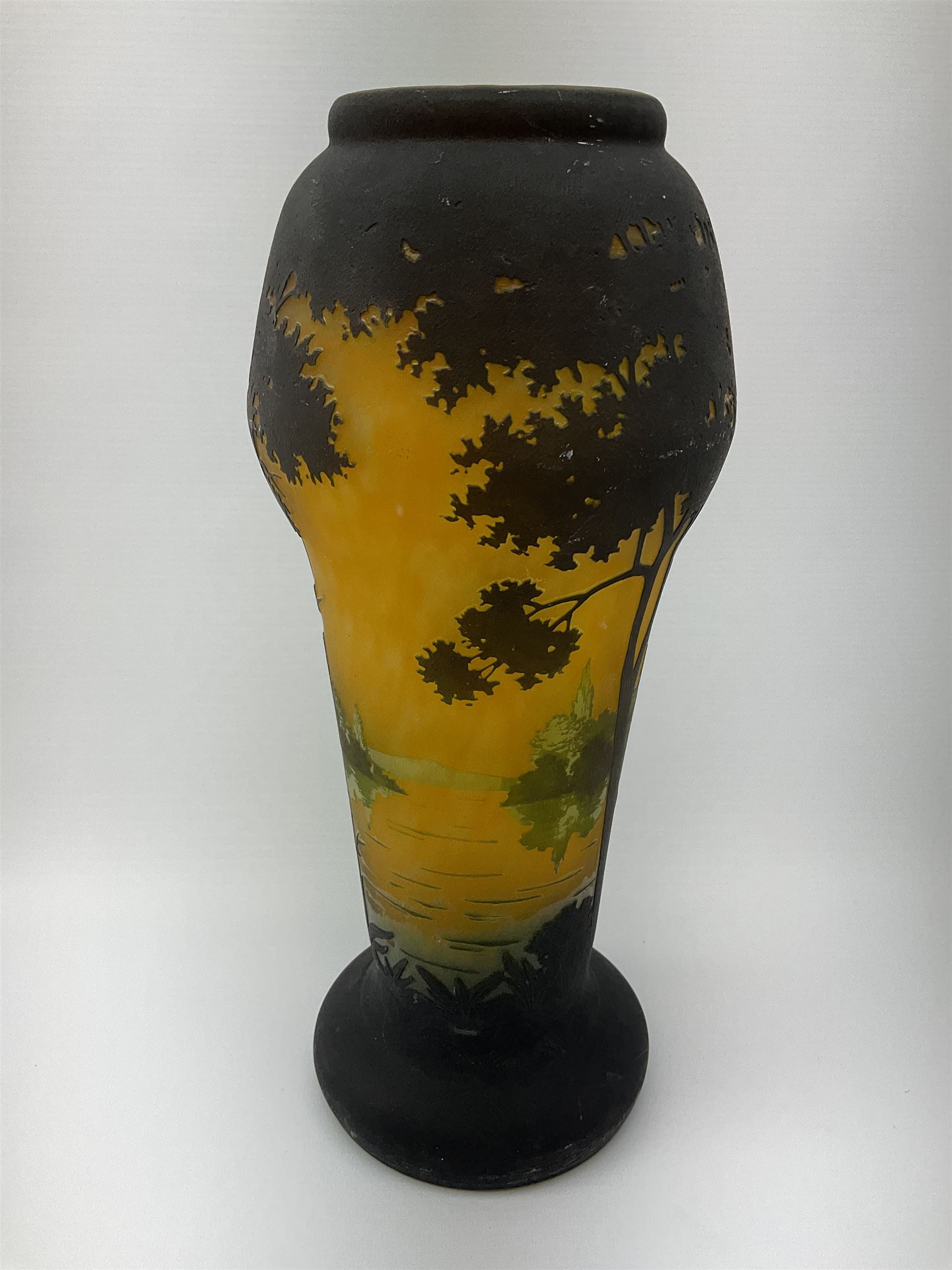 Reproduction Daum Nancy art nouveau style overlay and cut glass vase  decorated with woodland and a lake scene on a yellow ground, H35cm. 