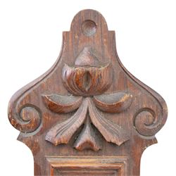 Victorian carved oak aneroid barometer, the foliate crest above a glazed thermometer, with scroll carved sides and circular dial below, H  60cm