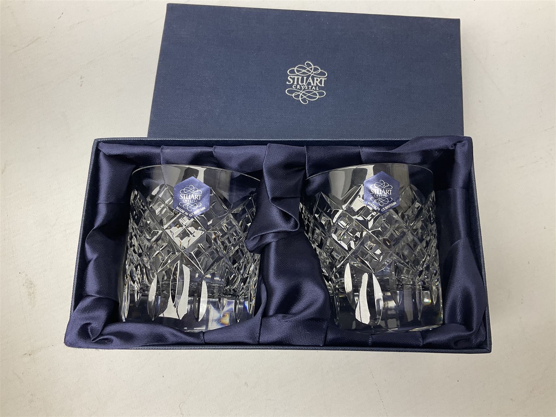 Boxed set of Banda carpet bowls, two boxed sets of Stuart glasses, Murano art glass bowl, cloisonné plate decorated with flowers upon gilt ground, silver plate and other metalware etc