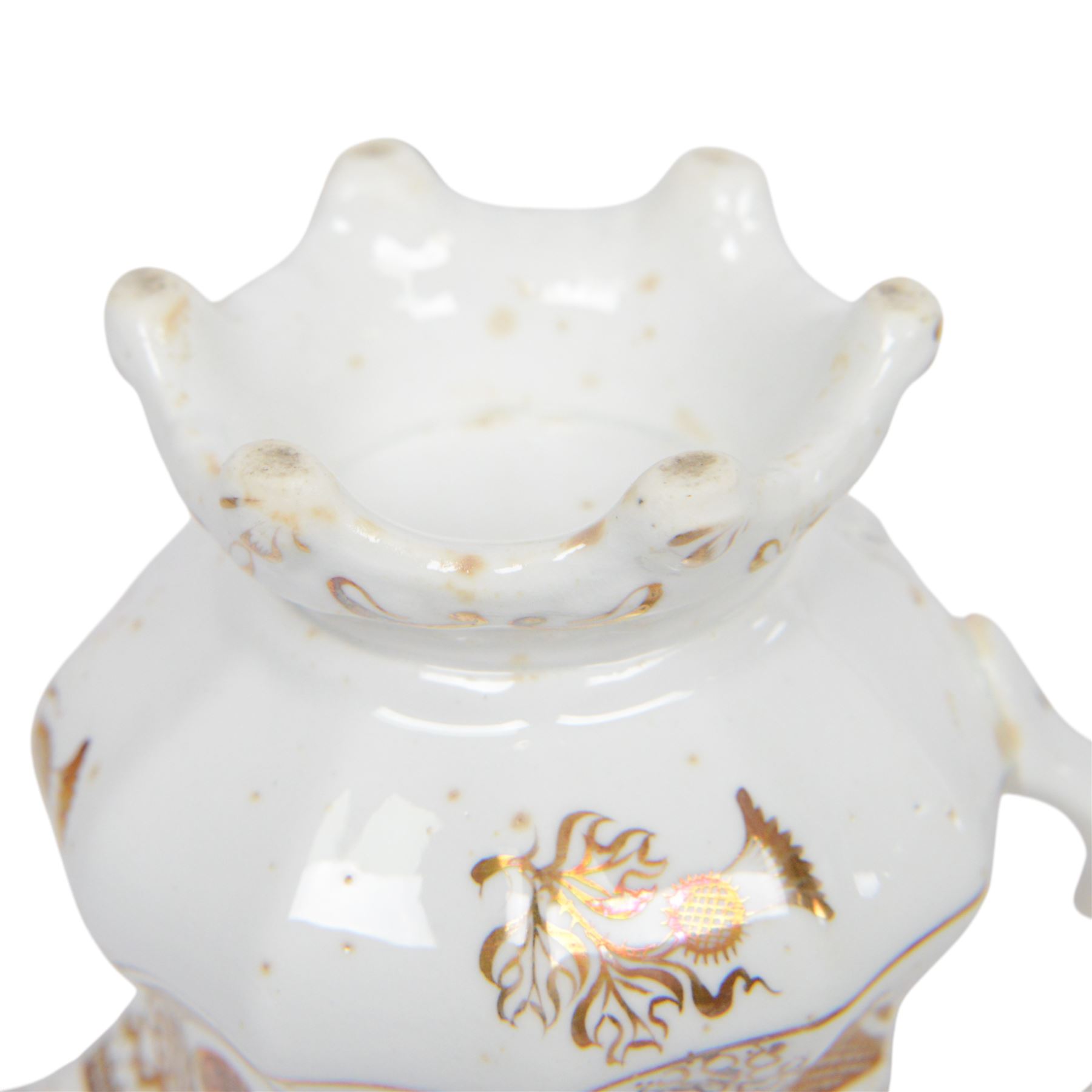 Late 19th century tea service, decorated in gilt with bands of seaweed type tendrils, thistles and cross hatch reserves upon a white glazed ground, comprising tea pot, twin handle lidded sucrier, milk jug, slop bowl, three serving plates, twelve cups and saucers and eleven side plates