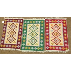  Set of three Turkish rugs with triple medallion centre, 60cm x 90cm (3)  