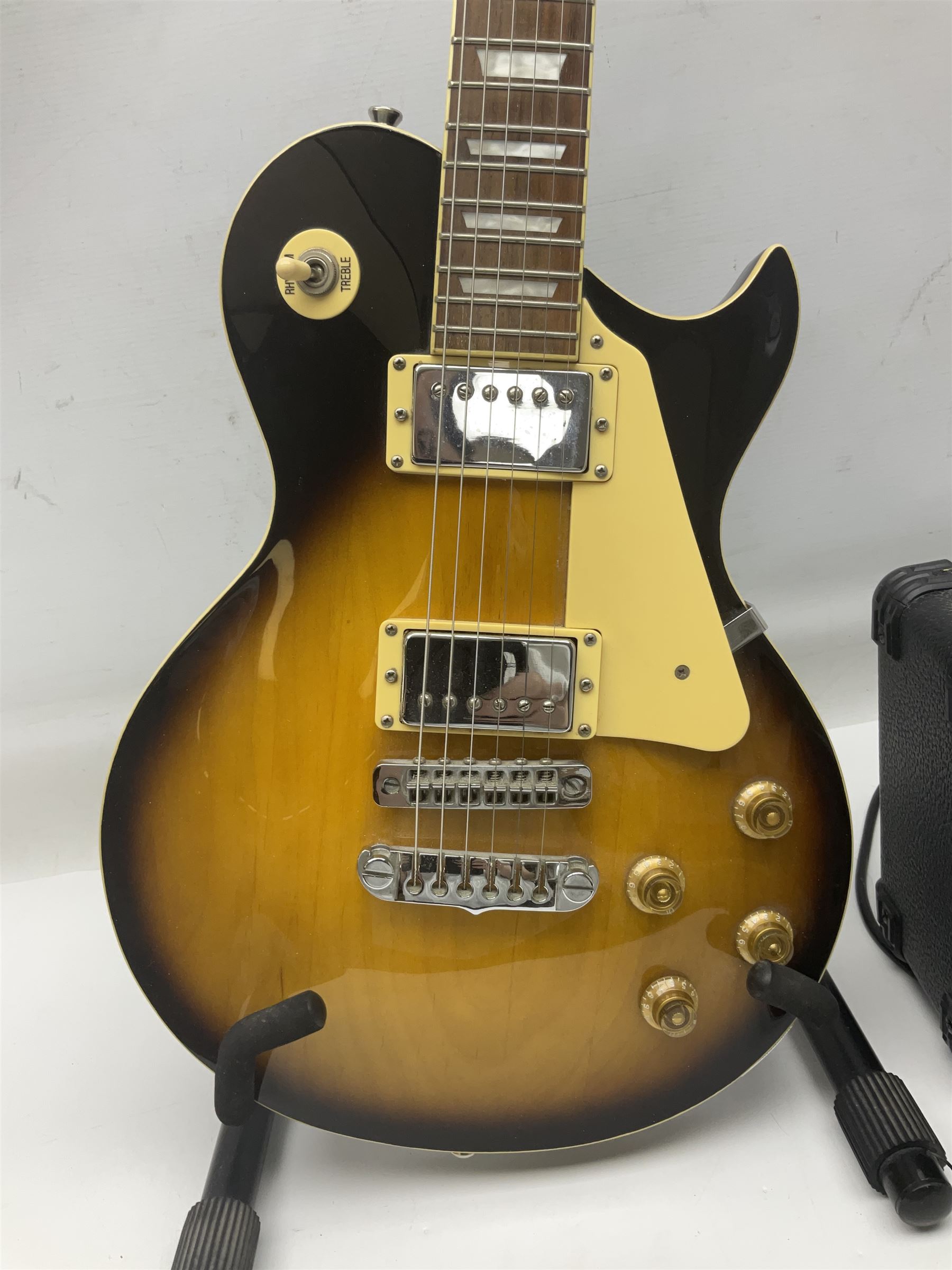 Aria Les Paul style electric guitar, no.037704CH L102cm; with amplifier, soft carrying case and stand; together with various guitar songbooks etc