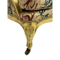 William Bertram & Son of London - pair late 19th century giltwood armchairs, moulded frame with scroll carved back and arm terminals, upholstered in striped fabric with foliate pattern, on shell carved cabriole supports, the brass castors stamped 