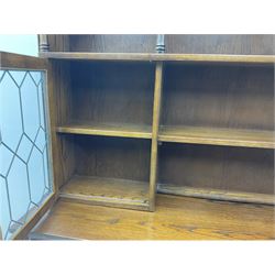 Old Charm oak wall display cabinet, fitted with two lead glazed doors above four drawers and four cupboards