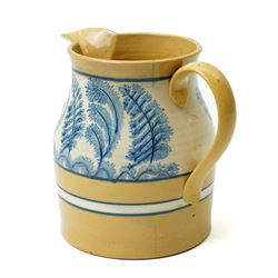 Late 19th century mocha ware jug, the yellow ground with cream and blue bands, and with typically decorated collar H18.5cm  
