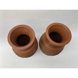 Pair of Chinese terracotta style vases, of baluster form with dragon decoration in low relief and fret border to rim, H25cm
