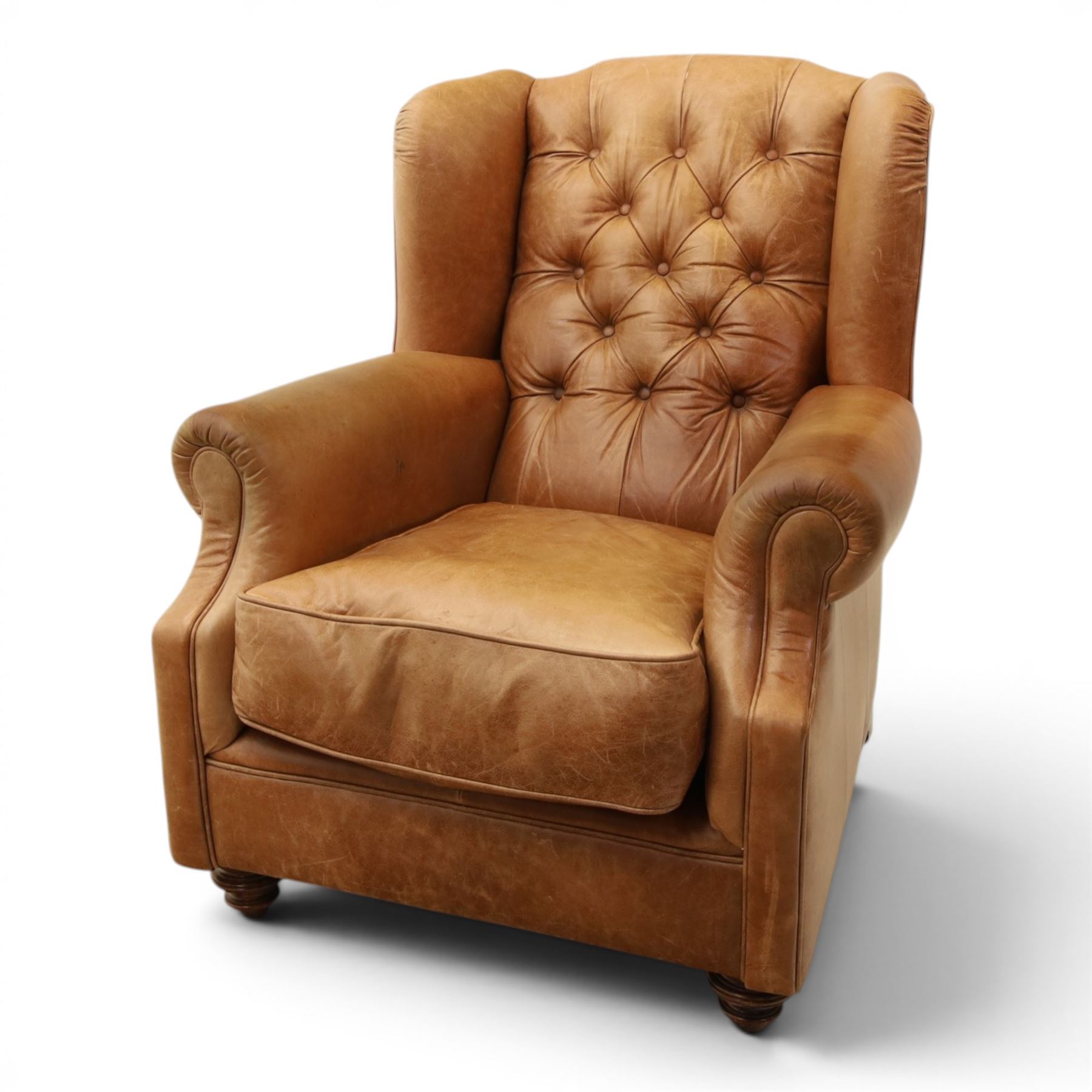 TETRAD for John Lewis - brown leather upholstered wingback armchair, button back with diamond tufted detail, loose seat cushion with piped edge, scroll arms and padded side wings, on short supports