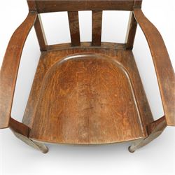 Arts and Crafts oak armchair, the shaped back with heart-shaped pierced splat above three vertical slats, solid dished seat with rounded front, open arms on turned front supports, square section legs united by plain stretchers