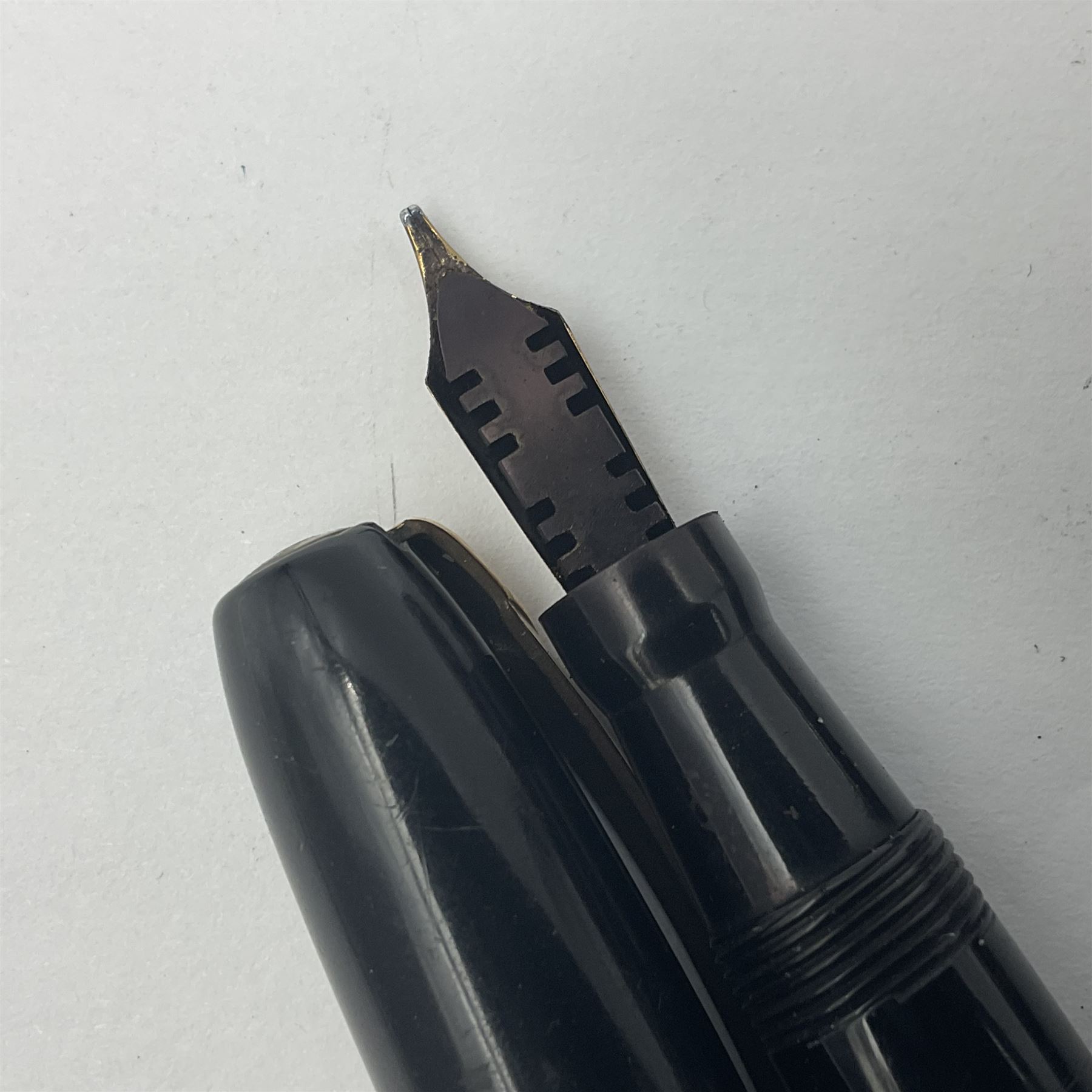 Three Swan Mabie Todd fountain pens, comprising Self Filler 3162 with black barrel and cap with single band and gold nib stamped Eternal 1 14ct, together with two Calligraph examples with gold nibs stamped 14ct, one with box, largest L12.5cm