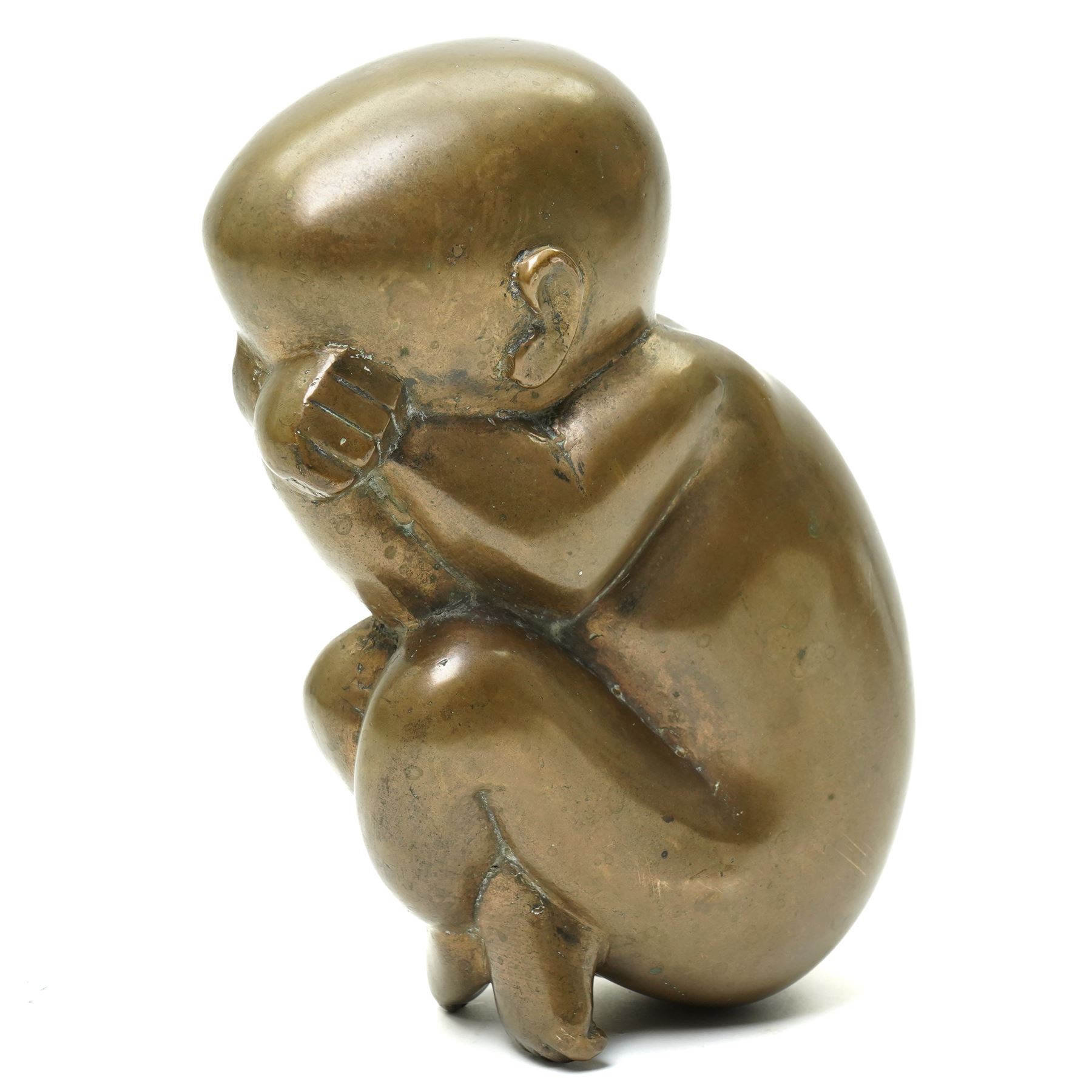Catharni Stern (British 1925-2015) -  Bronze sculpture of a baby in the foetal position 22cm, etched signature and with Alwin Gallery leaflet 