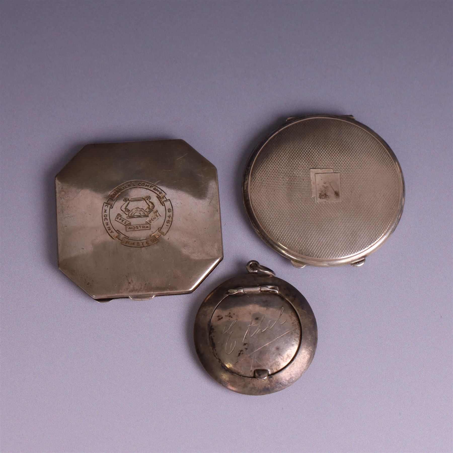 Two silver powder compacts, including octagonal example with Curriers Company engraving, Deakin & Francis Ltd, Birmingham 1948, 1930s circular compact with engine turned decoration, hallmarked Turner & Simpson Ltd, Birmingham 1936 and a silver pill box engraved with name