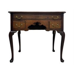 George II oak lowboy, moulded rectangular top over one long and two short drawers fitted with brass drop handles, shaped apron with scrollwork carvings, raised on cabriole supports