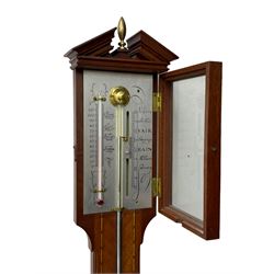 20th century - mercury cistern barometer in an 18th century style mahogany case with contrasting inlay and a broken pediment, round base with a turned cistern cover, fully exposed glass tube and silvered register within a glazed door, with a Fahrenheit spirit thermometer, engraved weather predictions and sliding vernier. Mercury clean and present.
