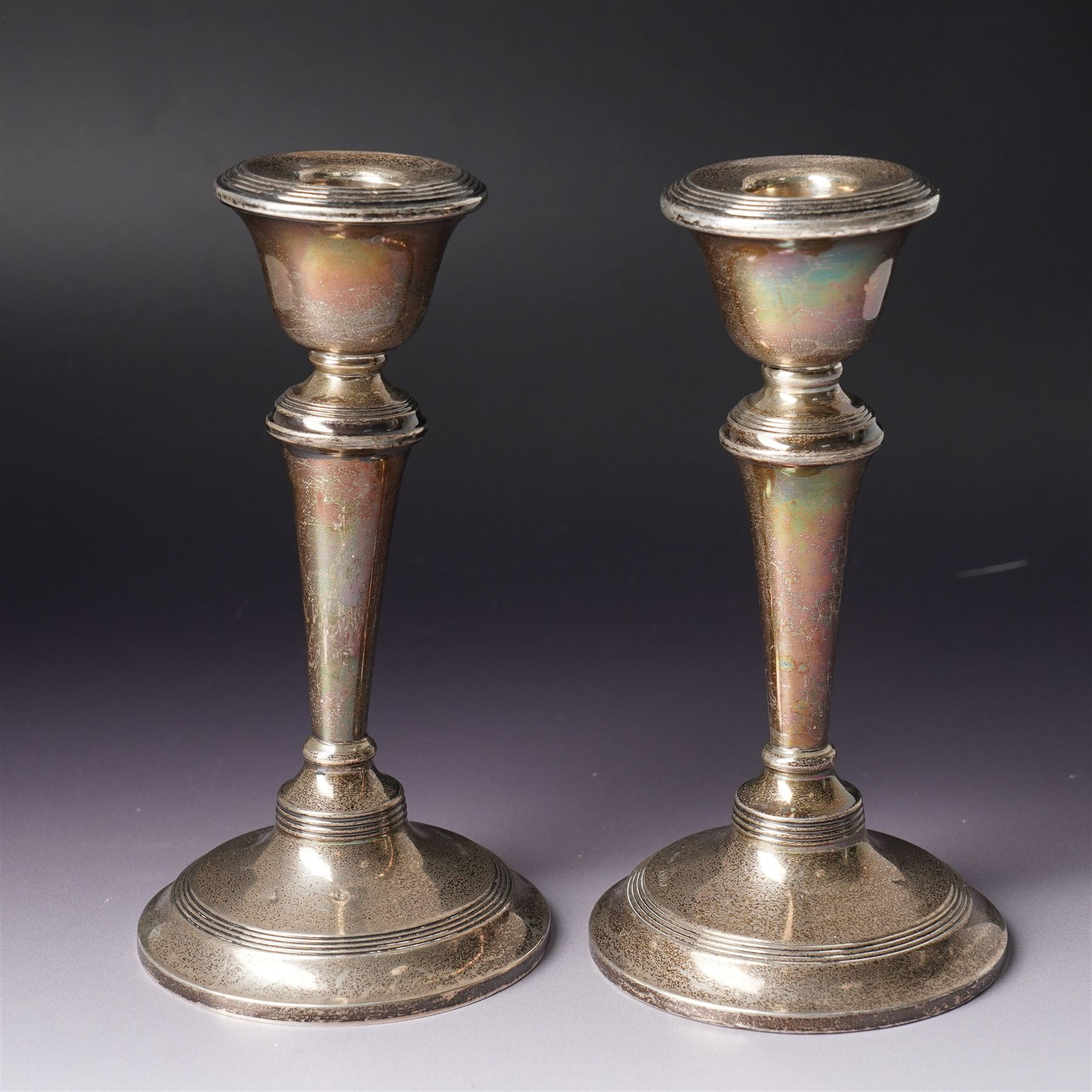 Pair of Edwardian silver candlesticks H16cm Chester 1908 Maker S Blanckensee & Son Ltd and a silver meat skewer/ paper knife, cased Sheffield 1977 Maker Cooper Bros