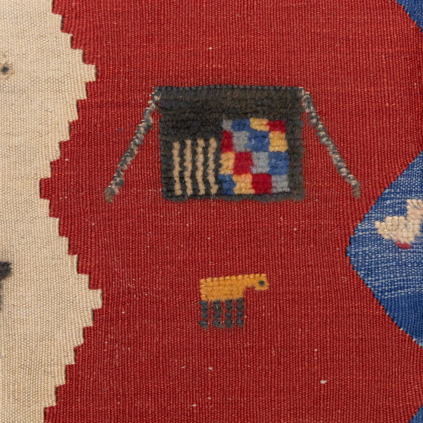 South West Persian Qashqai pictorial flatweave kilim, with central sinuous indigo river band dividing broad panels of madder red and camel yellow, red ground sparsely decorated with stylized animals, birds, and schematic shrubs, executed in bold geometric idiom, with fringe ends 