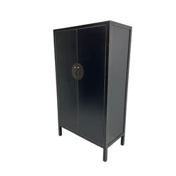 Chinese design black lacquered wardrobe, two cupboard doors enclosing hanging rail and two drawers