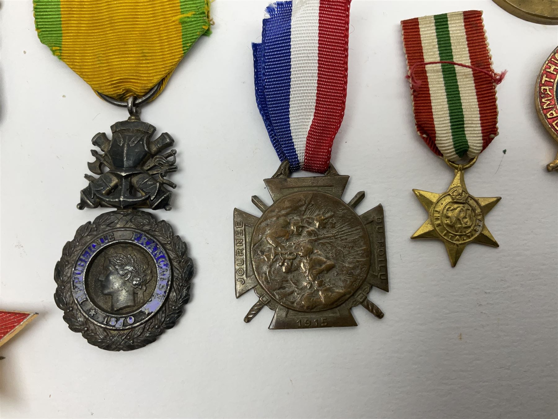 Five WW1 French medals comprising Medaille Militaire Gallantry Award, two Croix de Combattant, Medaille Commemorative Francais 1914-18 and a Patriotic Medal; together with small quantity of Russian badges etc