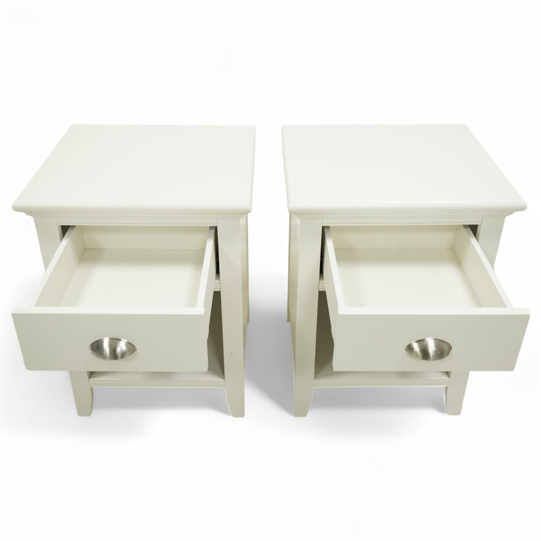 Barker & Stonehouse - pair of Carrington white bedside chests, each with moulded rectangular top over single drawer with brushed steel cup handle, open shelf below, on bracket feet