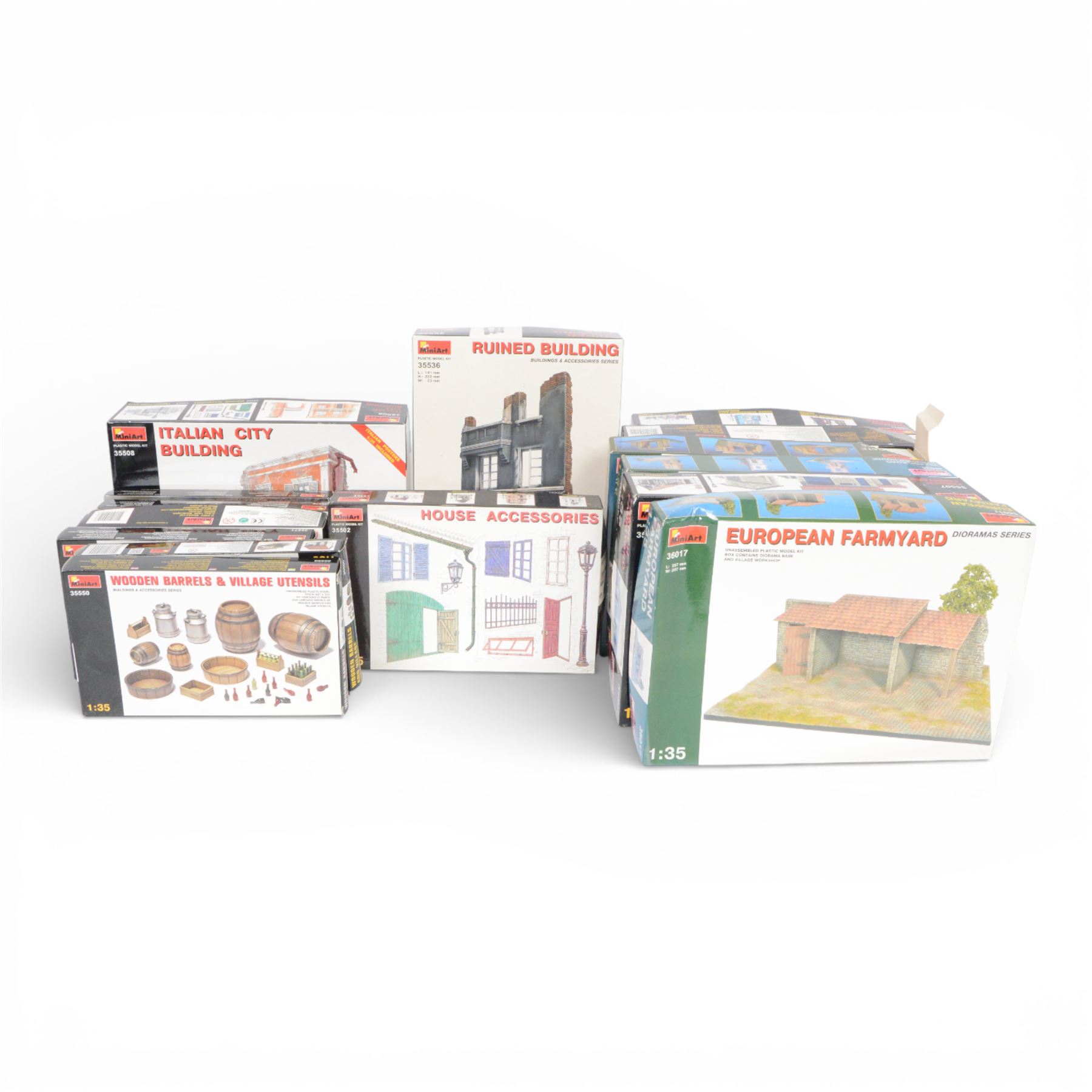 Seventeen Mini Art 1:35 scale model building and accessory kits, comprising 36017 European Farmyard, 35511 Ruined Garage, 35508 Italian City Building, 35536 Ruined Building, 35507 French Farmyard, 36020 Village Road with Ruined House, 36034 Farm Gate with Base, 35537 German Pharmacy Ruin, 35502 House Accessories, 35005 Building Accessories, 35583 Cable Spools, 35571 Wine Bottles and Crates, 35530 Street Accessories, 35578 Water Pump, 35581 Wooden Boxes and Crates and two 35550 Wooden Barrels and Village Utensils, all boxed
