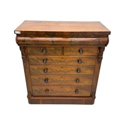 19th century flame mahogany Scotch chest, frieze long drawer above two short and four long graduating drawers, with turned knobs scrolled carved side bracket 