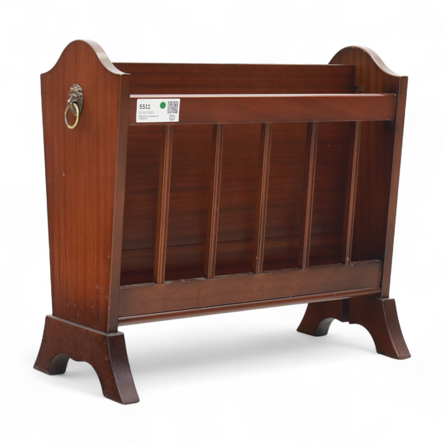 20th century mahogany magazine rack, with shaped ends and pierced divider slats, brass lion mask ring handles to each side, raised on splayed bracket feet