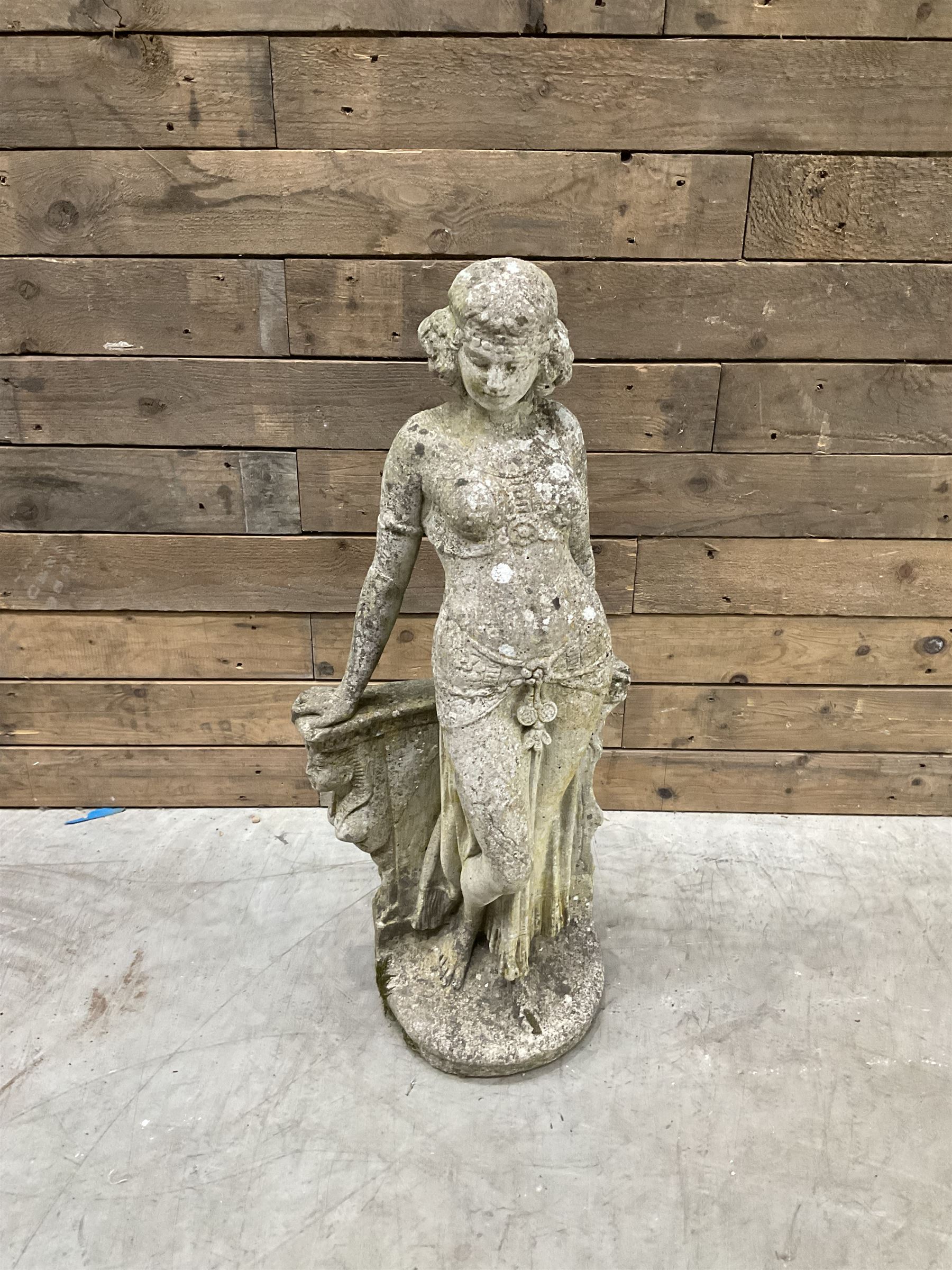 Pair of cast stone garden dogs and 2 female figures,