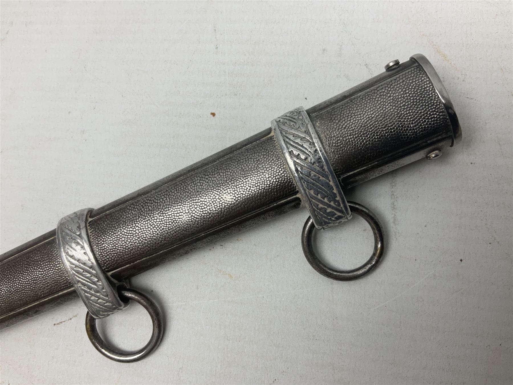 WW2 German Luftwaffe 2nd Pattern Officers dress dagger, with unmarked 25.5cm double edged steel blade, wire-bound pale orange/yellow celluloid grip, globular  pommel with oak leaves and traces of gilding, Luftwaffe eagle cross guard; in beaded scabbard with two suspension rings L43cm overall