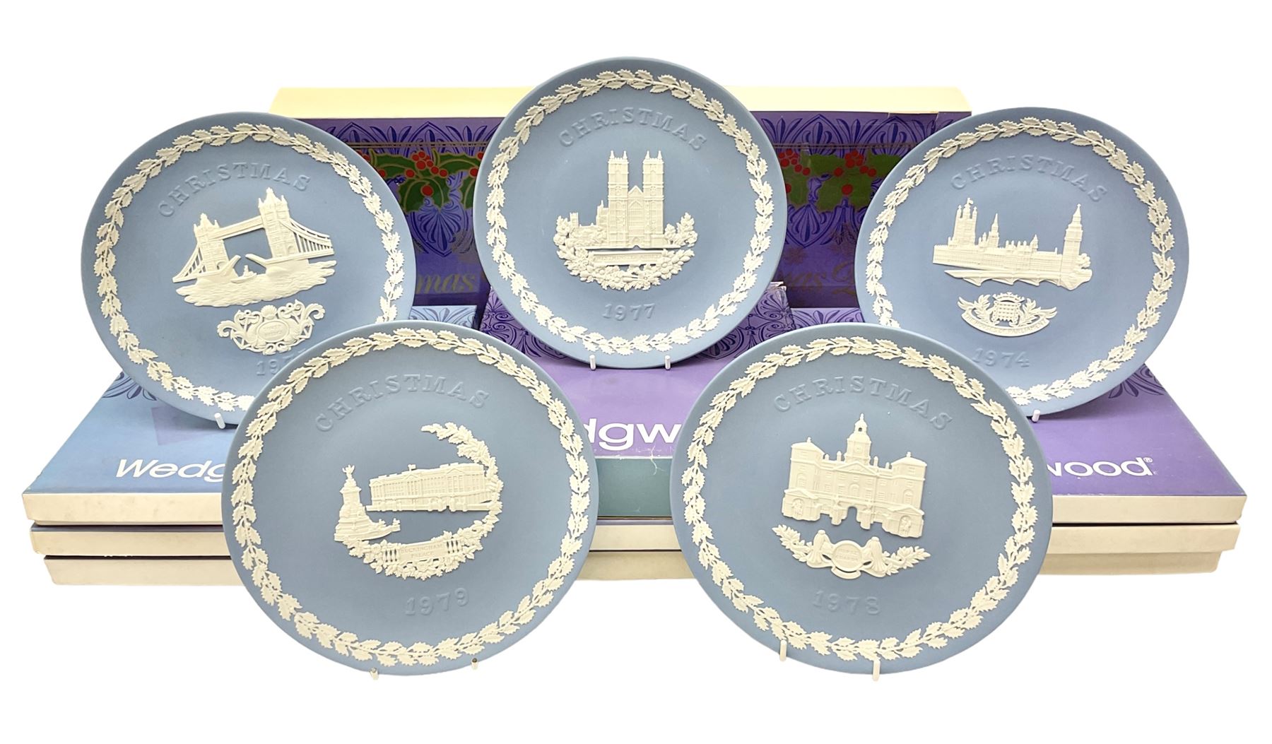 Eleven Wedgwood Jasperware Christmas collectors plates London Landmarks, comprising 1969 Windsor Castle, 1970 Trafalgar Square, 1971 Piccadilly Circus, 1972 St Pauls Cathedral, 1973 Tower of London, 1974 House of Parliament, 1975 Tower Bridge, 1976 Hampton Court, 1977 Westminster Abbey, 1978 Horse Guards and 1979 Buckingham Palace. all in original boxes  