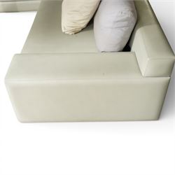 Christian Liaigre (1943-2020) - 'Arpege' handmade L-shaped sectional sofa, upholstered in neutral leather, with broad squared arms, deep seat cushions, angled chaise section, loose back cushions, raised on block feet