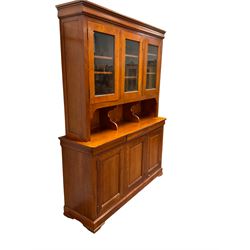 Multi-York -  Loire cherry wood dresser, shaped cornice over three glazed doors enclosing six shelves, the lower section fitted with three shallow drawers with shaped fronts over three cupboards with panelled doors, raised on plinth base with bracket feet