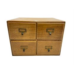 Mid-20th century oak desktop filing cabinet, fitted with four drawers with brass handles and index card holders