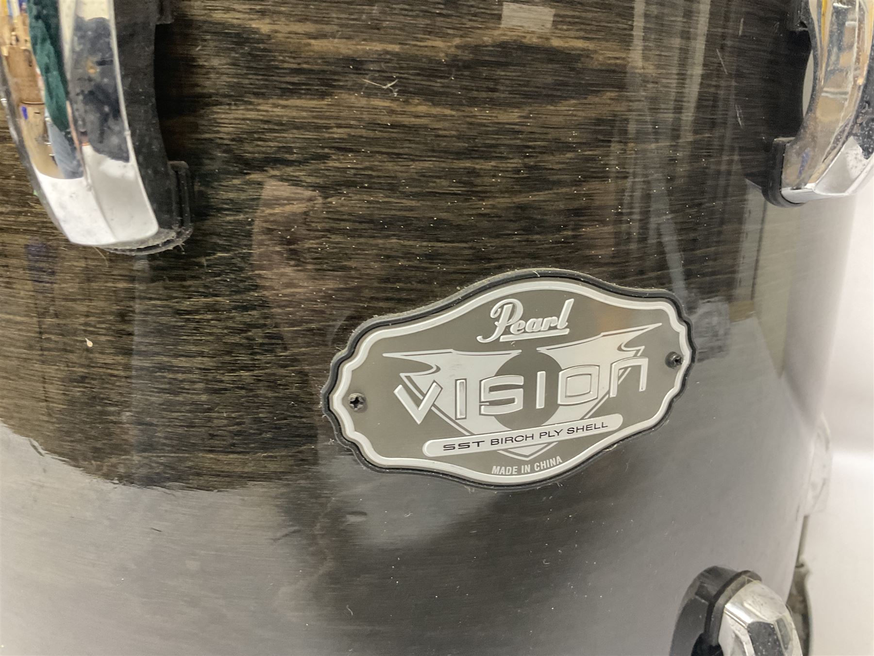 Pearl Vision SST Birch Ply shell four-piece drum kit in black comprising bass drum with foot pedal and three graduated toms; together with Pearl Custom Alloy Sensitone steel snare drum, drum and cymbal stands, microphone stand, stool and various drum sticks 