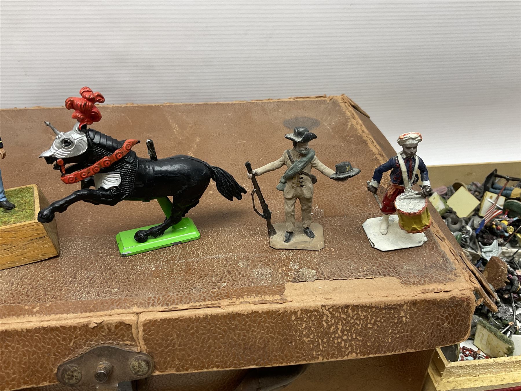 Large variety of predominantly metal miniature soldiers, a mixture of painted and non-painted figures, to include examples of American, British and European soldiers 