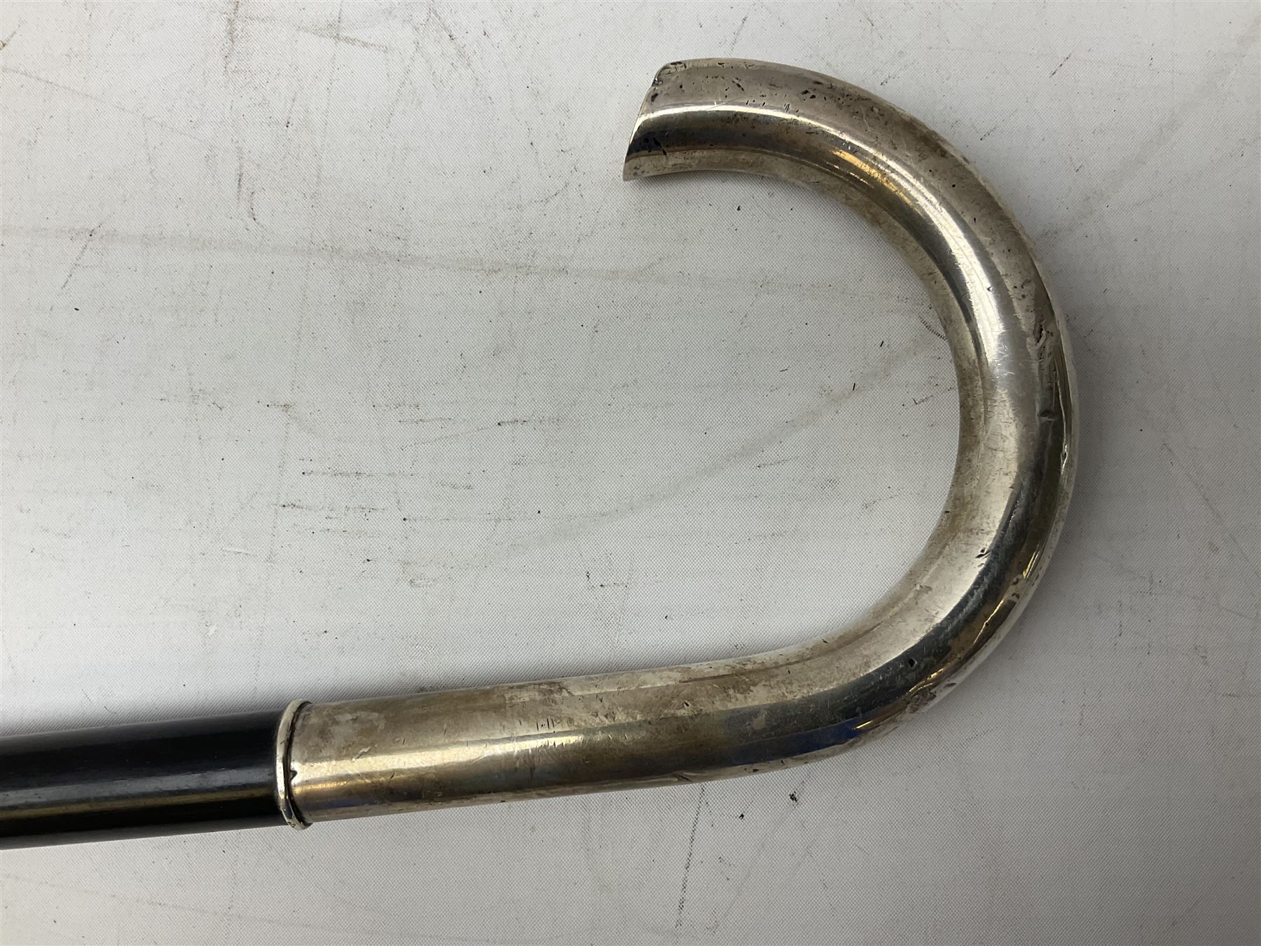 Continental silver handled walking cane, unmarked but testing around 800 standard, with engraved monogram to terminal, upon an ebonised cane, approximately H91.5cm