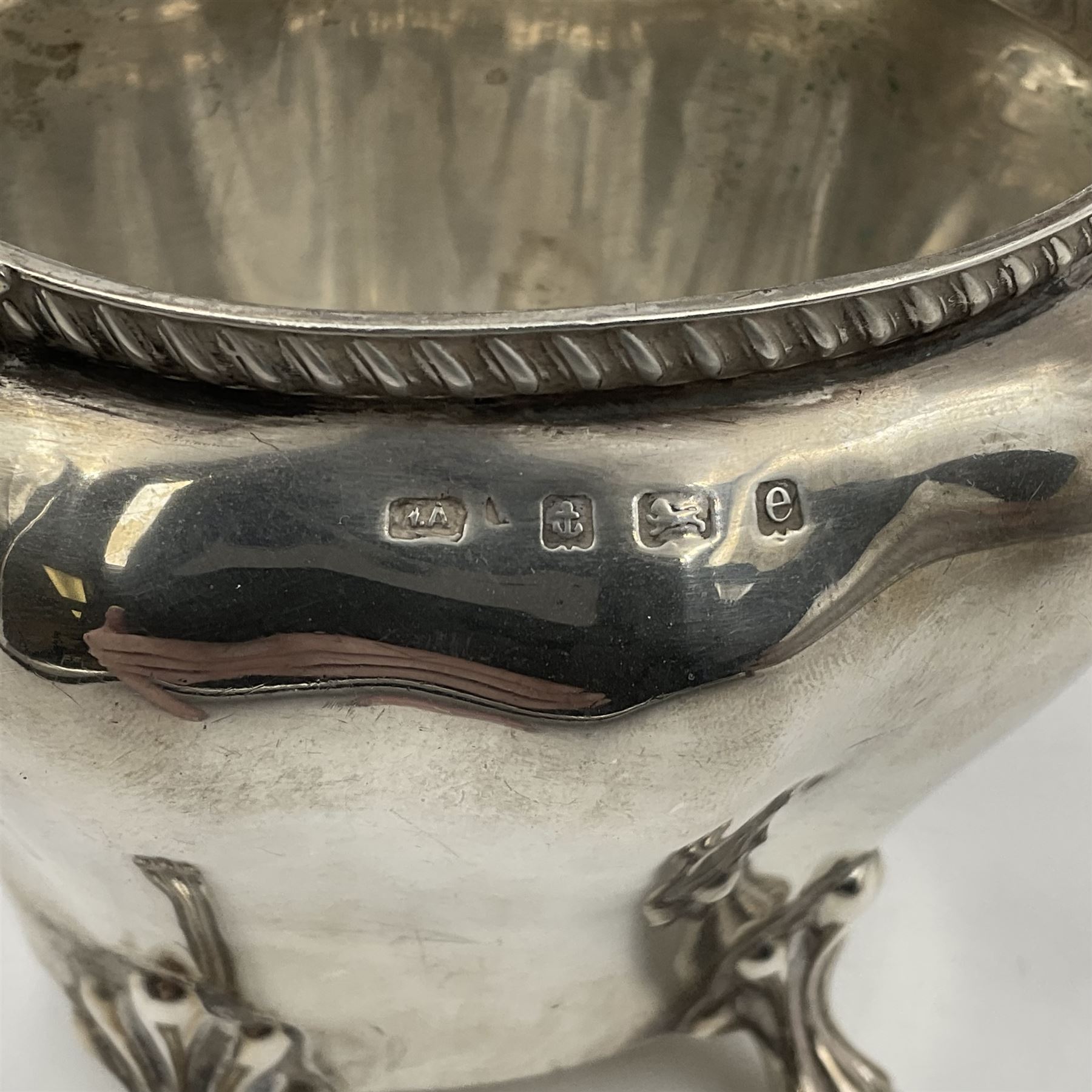 Five piece Edwardian silver tea service, comprising teapot and coffee pot, each with ebonised scroll handle, tea caddy with hinged cover, twin handled open sucrier, and milk jug, each of rounded bombe form, upon four paw feet, hallmarked William Adams Ltd, Birmingham 1904 and 1905, coffee pot H26cm
